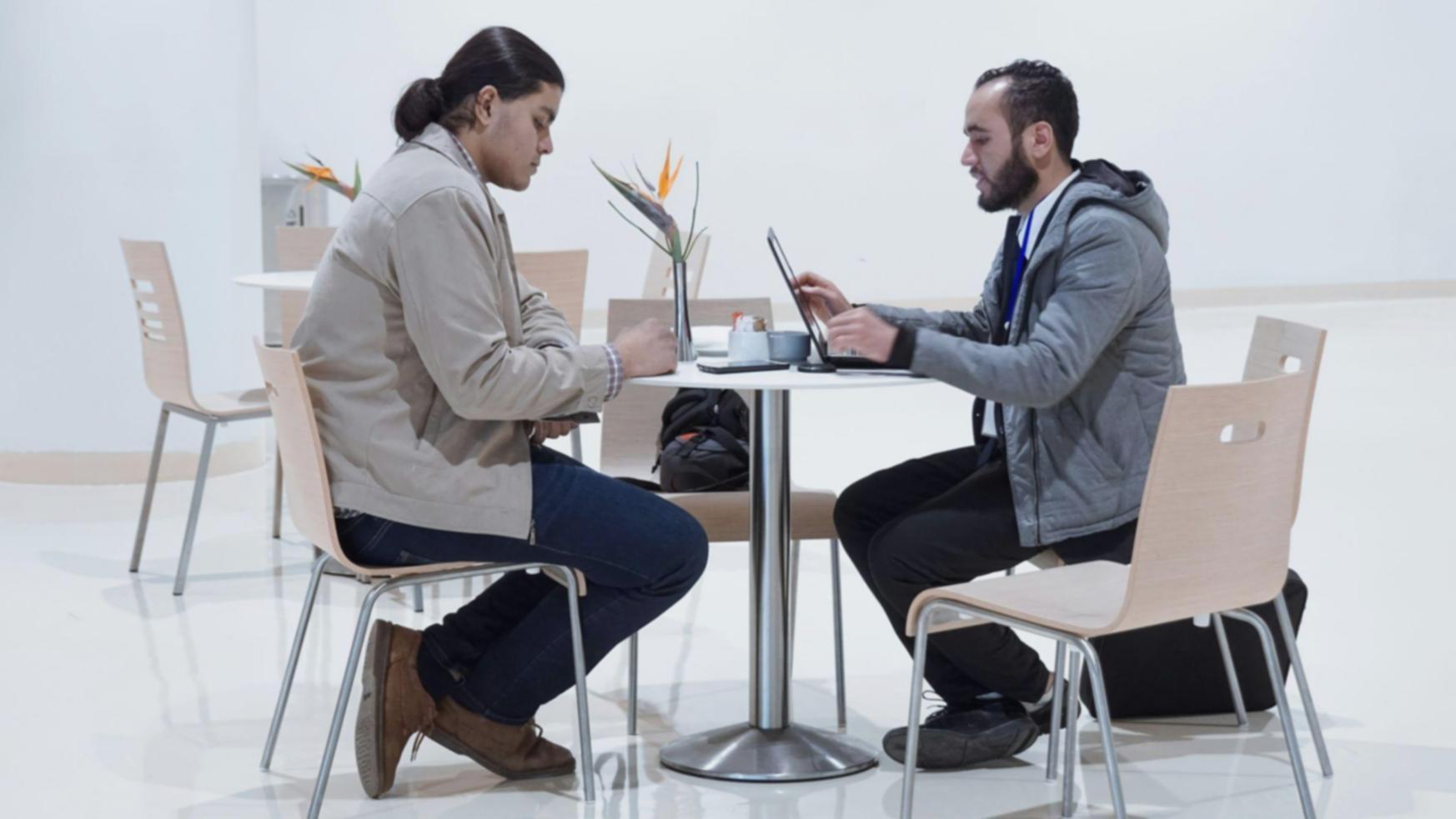 Stakeholder meeting reviewing testing results and project outcomes